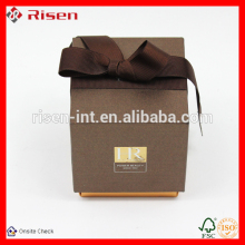 small ring gift brown package box with brown ribbon