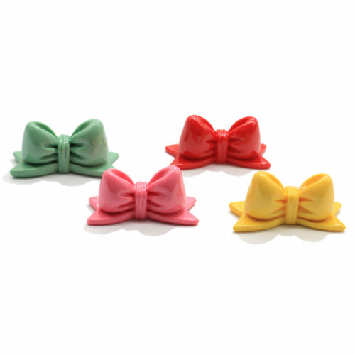 Venta al por mayor colorido Bowknot resina cuentas cabujón DIY arte decoración niñas horquilla fabricación llavero adorno joyería artesanías