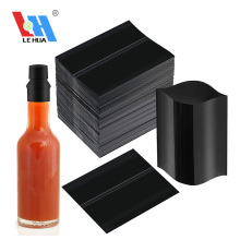 Banda retráctil negra para tapas de botellas de salsa