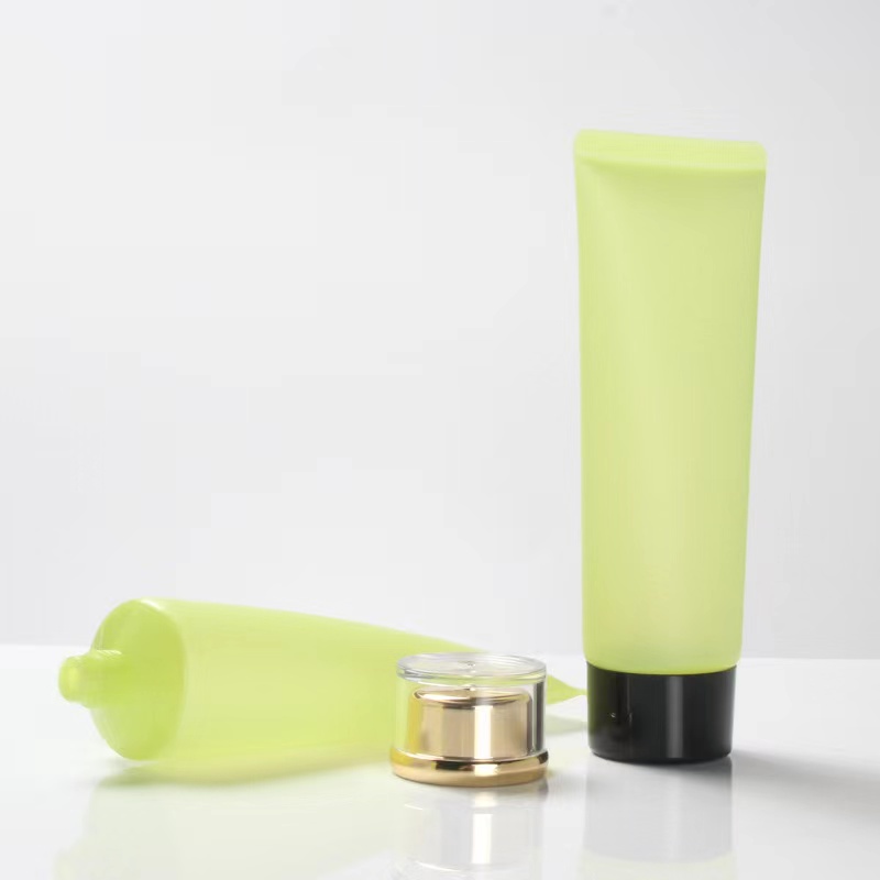 Vendita calda Crema solare cosmetica opaca con tubo in plastica verde glassata con coperchio acrilico a vite