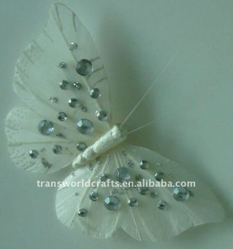 White decorated butterfly with bead