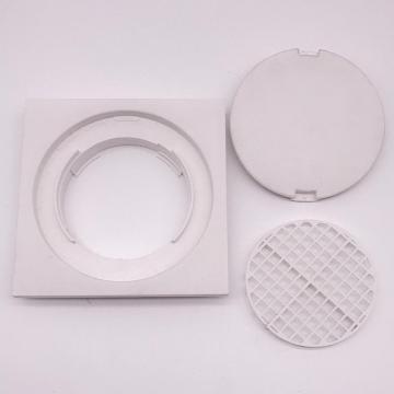 White plastic square tile floor drain shower drain