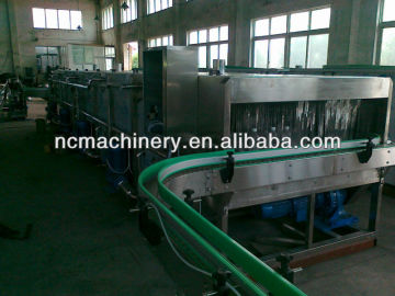 Continuous spray tunnel pasteurizer