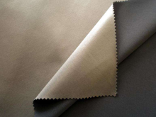 Solvent based laminating resin for fabric to fabric