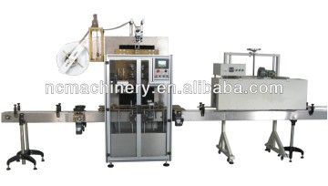 Milk bottle sleeve labeling machine and shrink tunnel