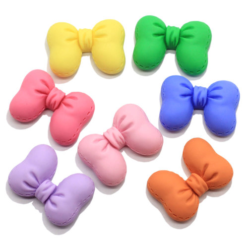 Venta al por mayor Pretty Bowknot resina Flatback Beads Artificial DIY decoración pajarita accesorio de adorno hecho a mano