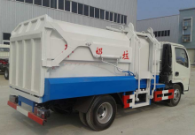 Side loader compression refuse truck