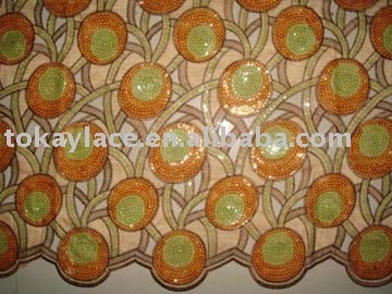 African handcut lace inlaid with many paillettes