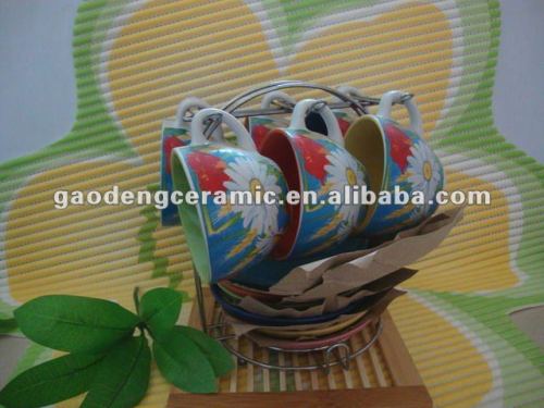glazed coffee cup and saucer with colorful flower