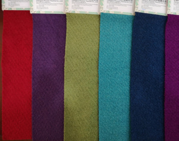 Knitted wool viscose polyester blend boucle fabric