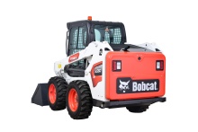 Road scraper skid steer loader