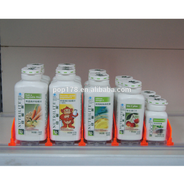 Retail auto-feed shelf display pusher for drugstores display