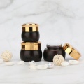 Brown Cosmetic glass bottle with golden caps