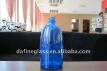 spray painted blue glass wine bottle