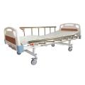 Cama manual de hospital con rieles laterales