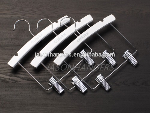 Wooden white kids clothes hanger and children hanger with metal clips for pants