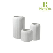 Three sizes of planters with vertical stripes