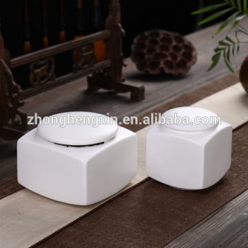 White galazed ceramic funeral pet ashes urns