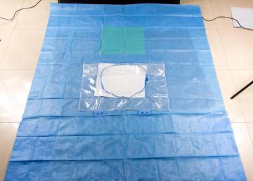 Disposable surgical drape with pe and absorbant PP