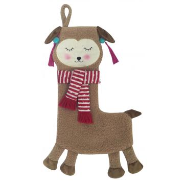 sheep with plush Christmas stocking