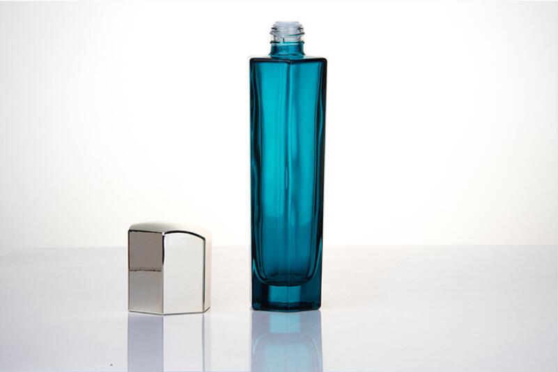 Blue glass hexagon cosmetic containers with silver cap