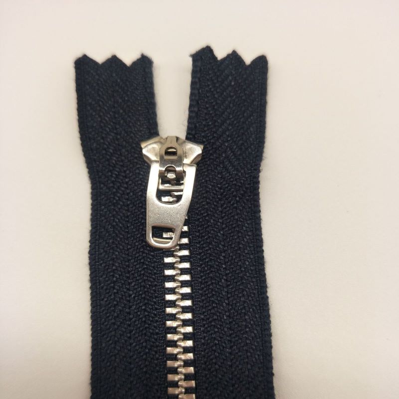 Metal separating zippers