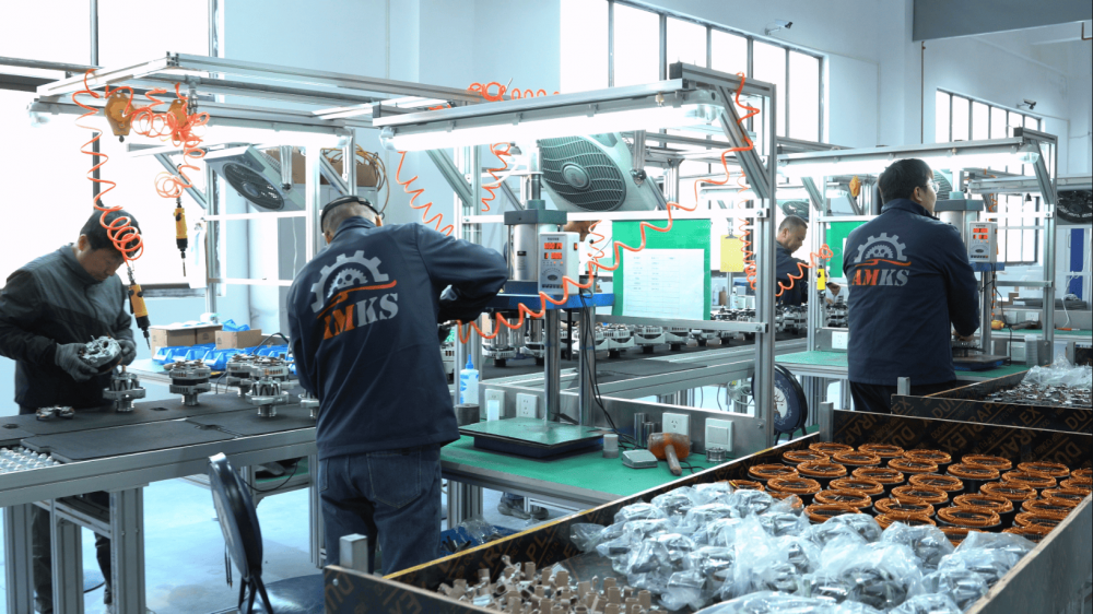 Workers Assembling Auto Electrical Components