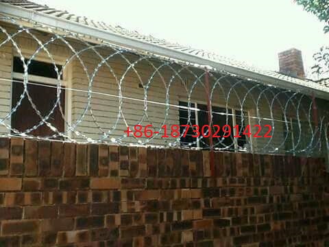 450mm coil diameter Razor wire flat wrap coils as a clapped into a flat panel formation.