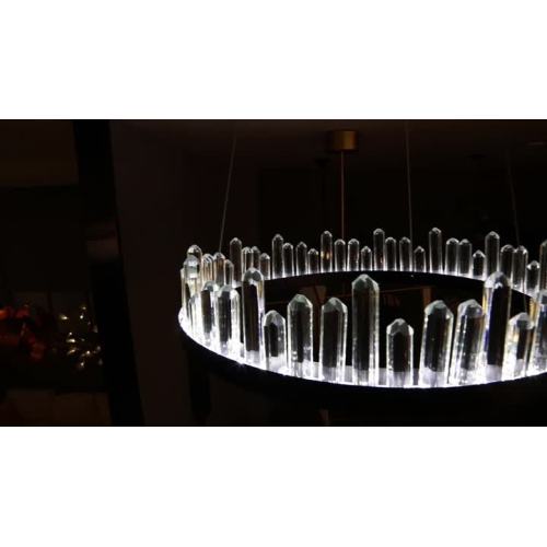 Crystal stands on a black ring LED pendant light