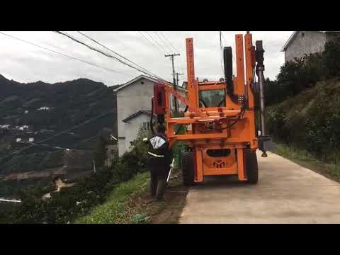 Highway guardrail pile driver