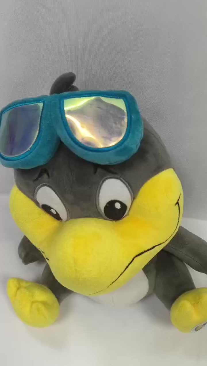 Grey duck stuffed animal with swimming goggles