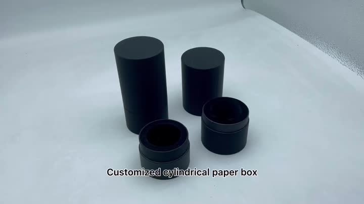 Zwarte cilindrische doos voor parfum