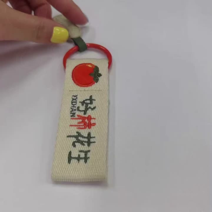 Tenun reben bersulam logo loket kecil