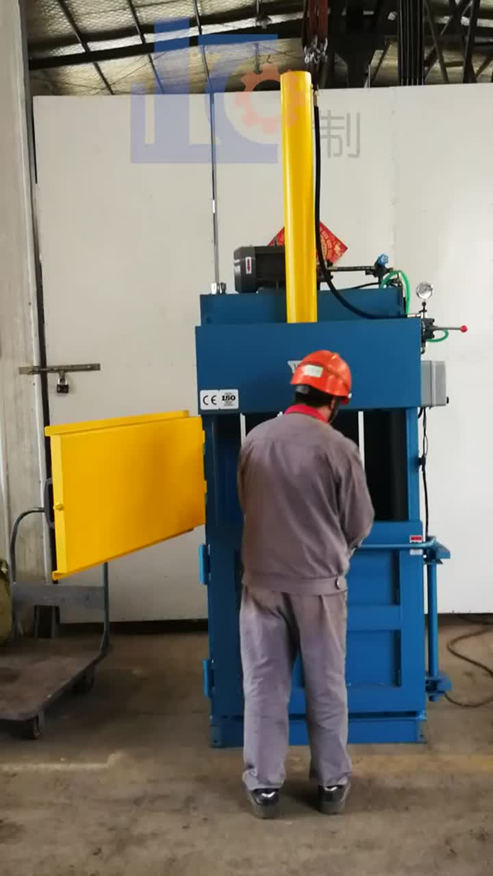 Vertical cotton materials baler