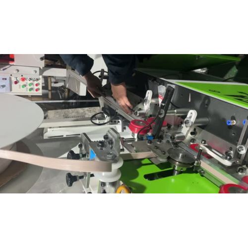 Máquina de inserção de tira de borracha