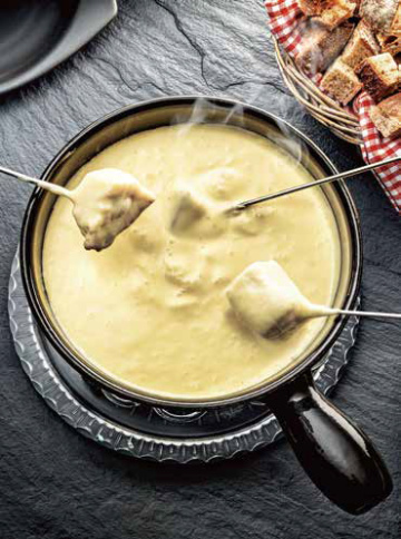 Disfruta deliciosa fondue de queso mientras mira los Juegos Olímpicos