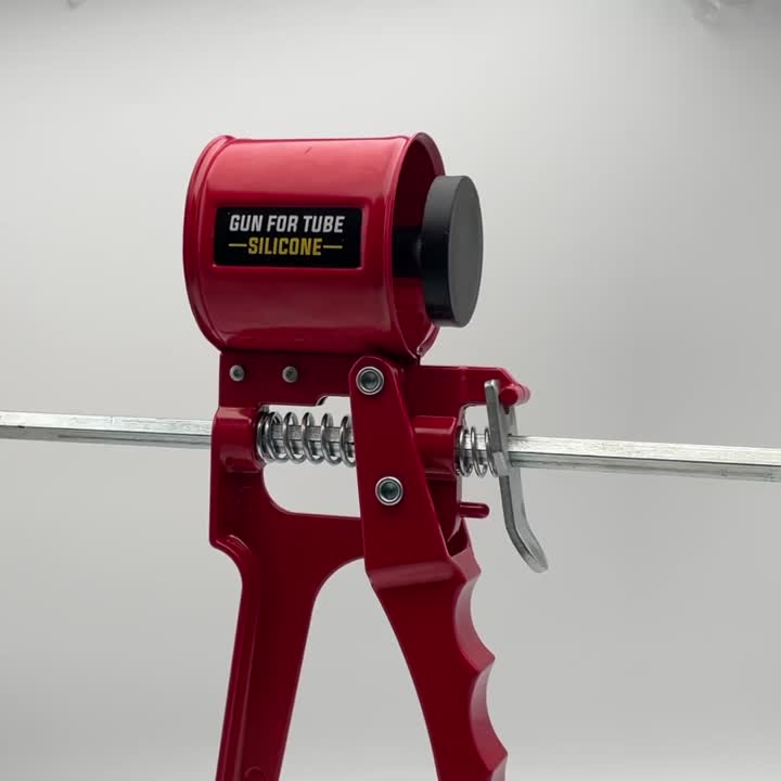 Pistol caulking logam merah