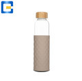 Innovative Bamboo/Wooden Lid Borosilicate Glass Water Bottle with Silicone Band1