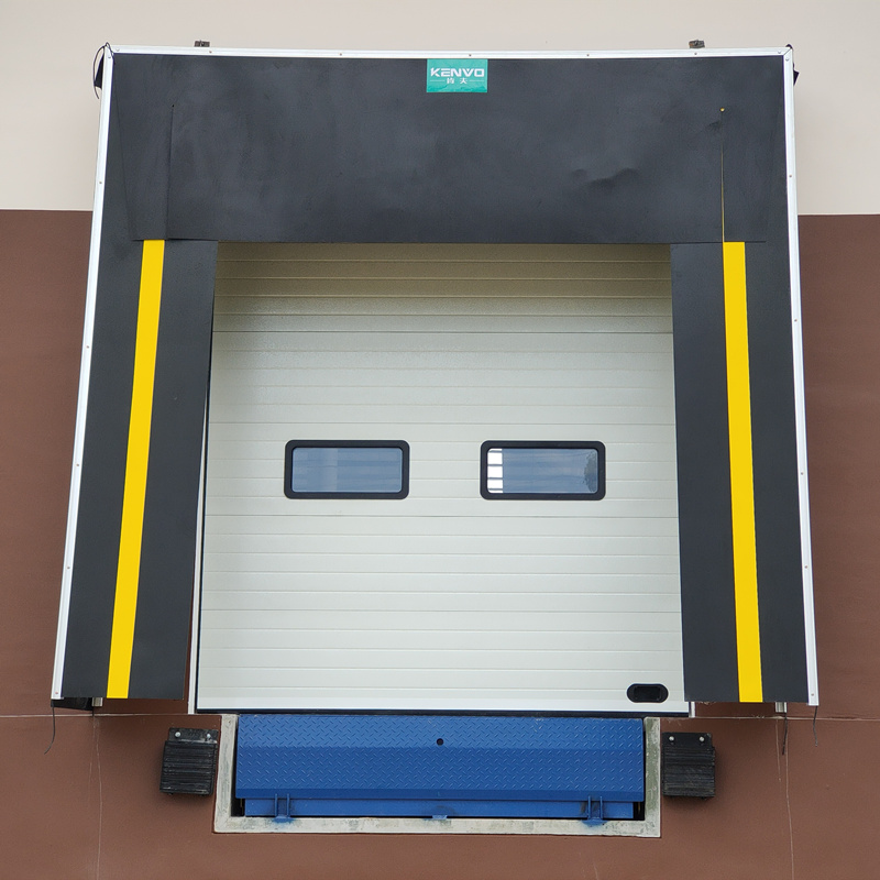 Warehouse loading dock with dock leveler 