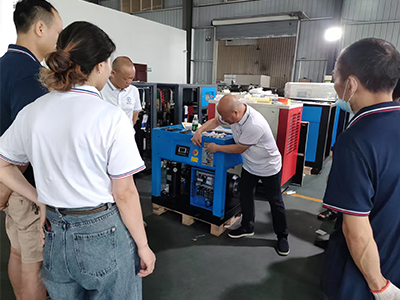 What is the working principle of an air compressor?