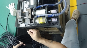 Workers used a cable stripper to strip the insulation from some of the cables