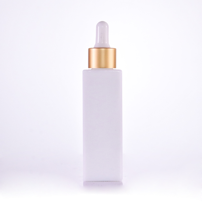 Opal white square bottle with golden dropper cap