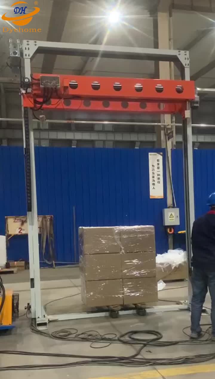 Pallet wrapping machine with top sheet