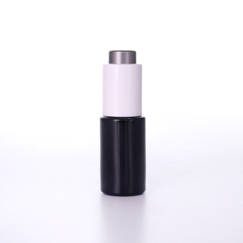 Schwarze Glasflasche mit Push-Knopf-Pipette