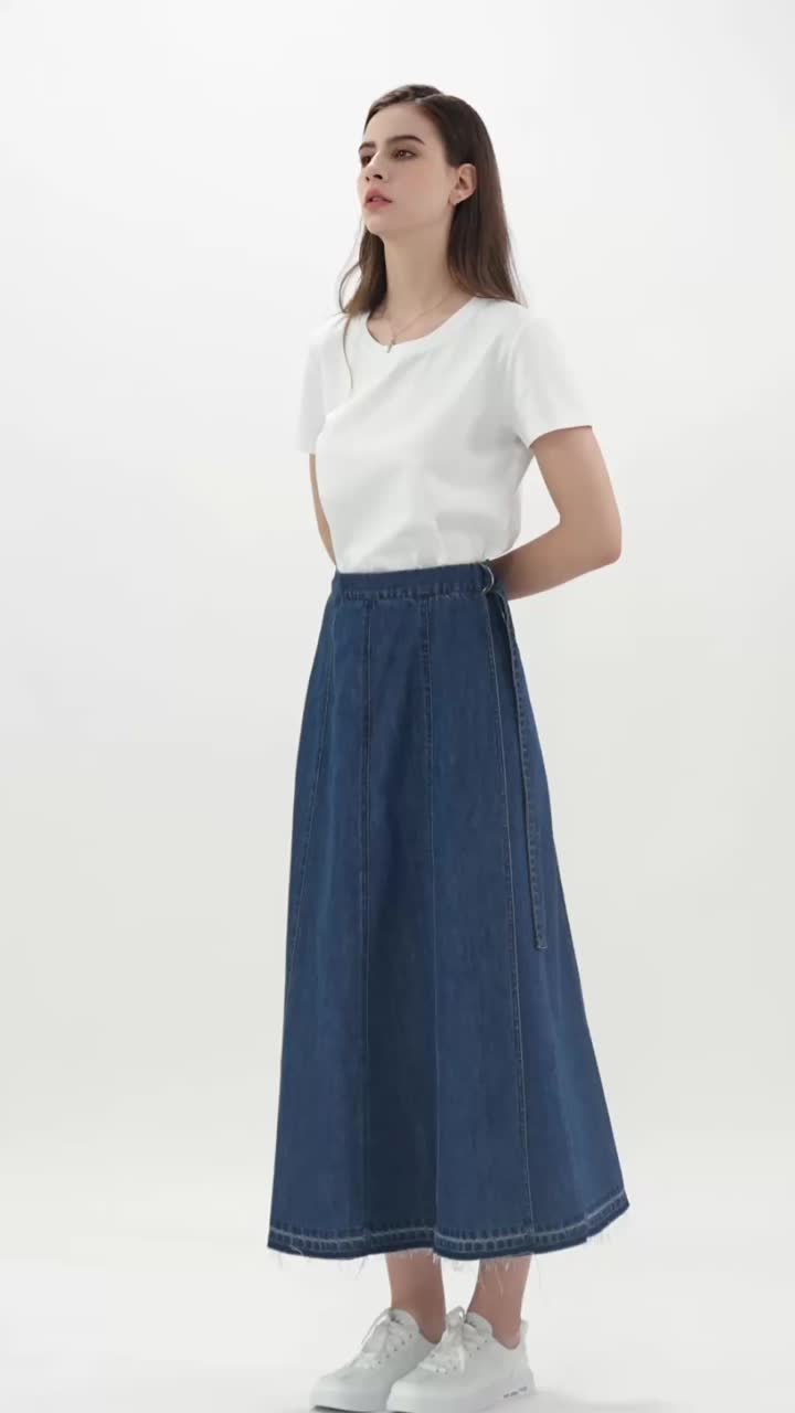 A one-piece denim skirt with straps. 