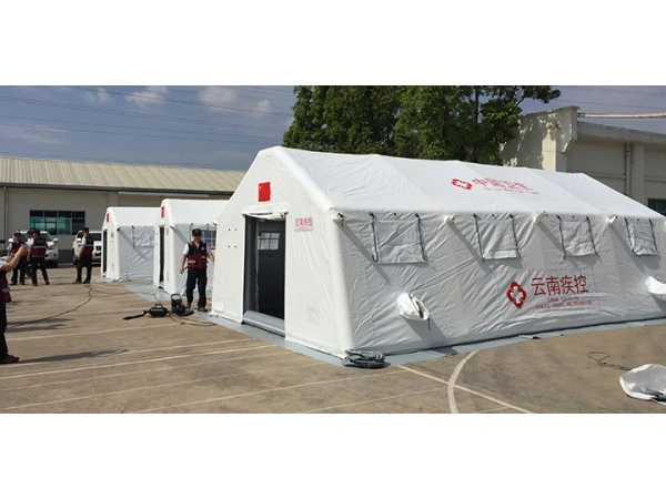 Orange inflatable decontamination tent deployed in field application