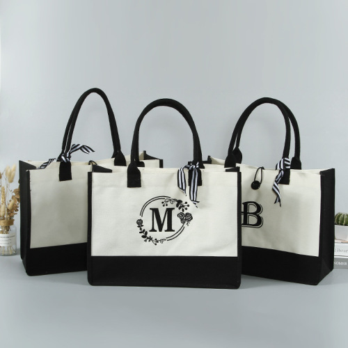 The Must-Have Accessory of the Year: Black and White Monogram Canvas Bags