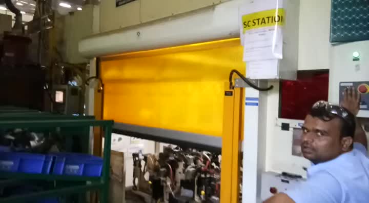 Fabric rapid rolling door for robotic welding cell