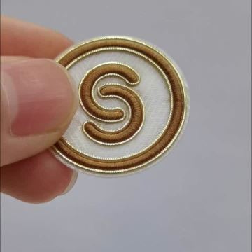 High frequency label with embroidered logo