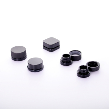 Small black cream jar with anti-theft cover